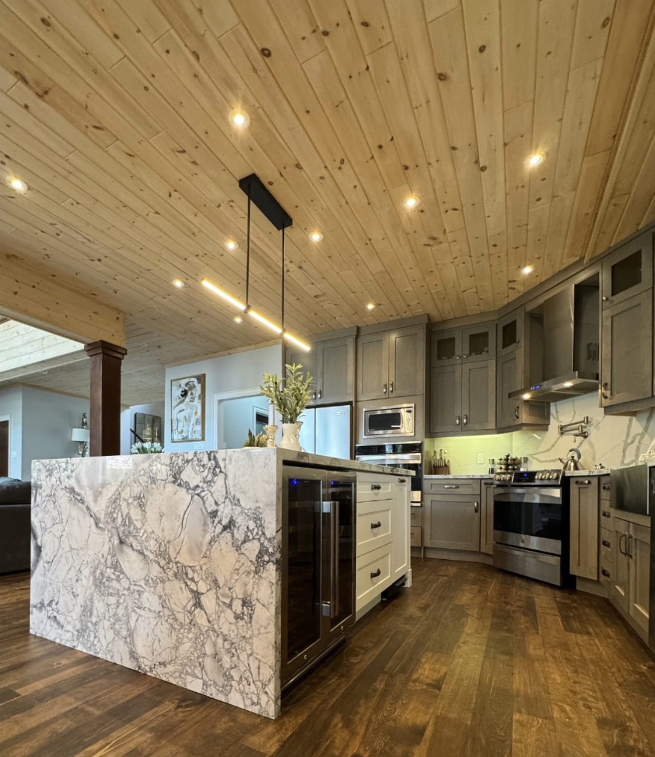 Custom kitchen with marble waterfall island