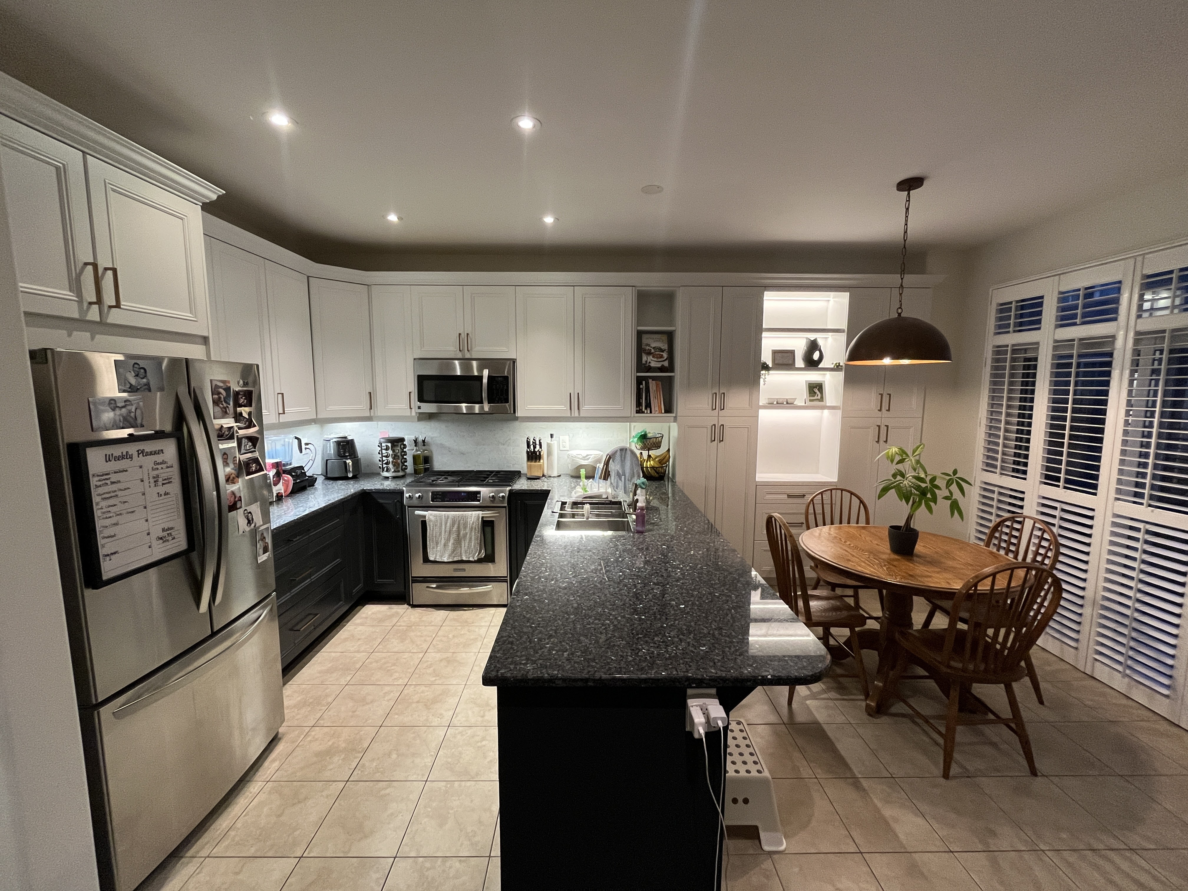 White kitchen with built-ins and glass display